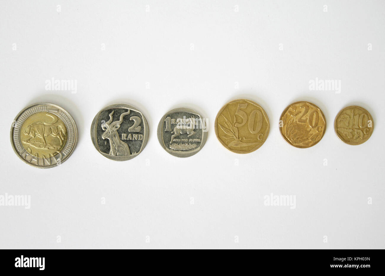 Close-up di una fila di South African monete Foto Stock