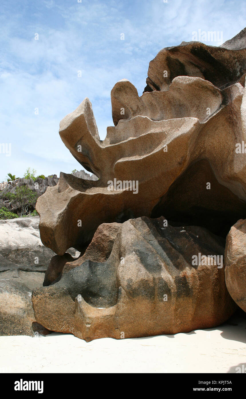 Spiaggia rocciosa isola Curieuse, Seychelles. Foto Stock