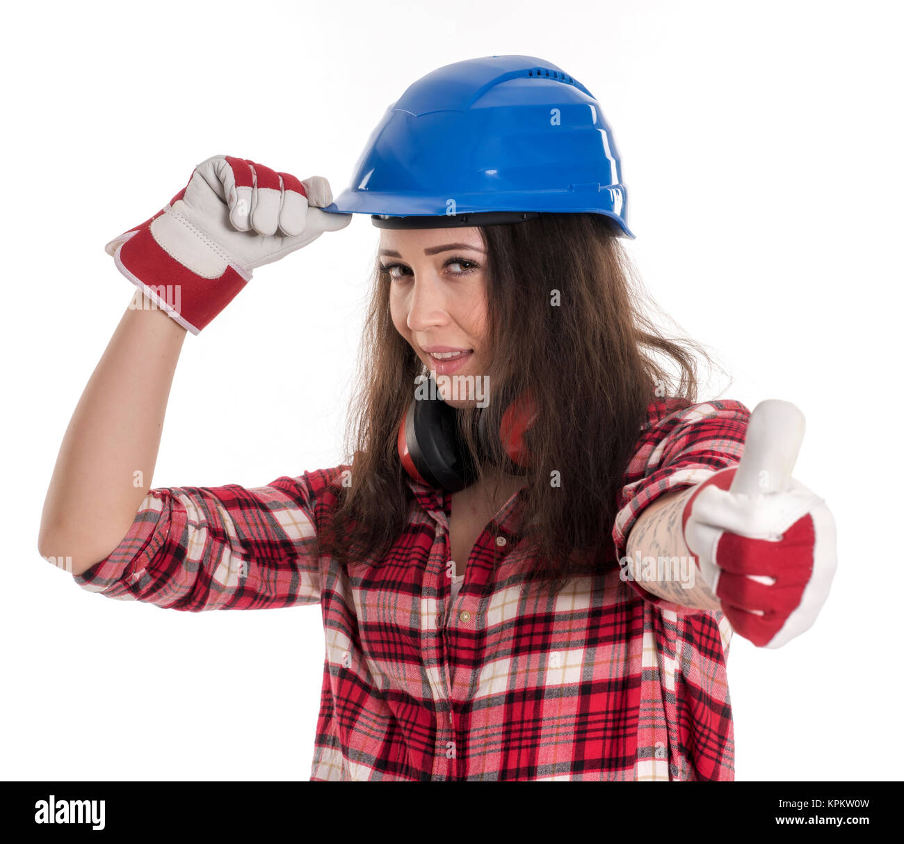 Artigiani femmina con il casco che mostra pollice in alto Foto Stock