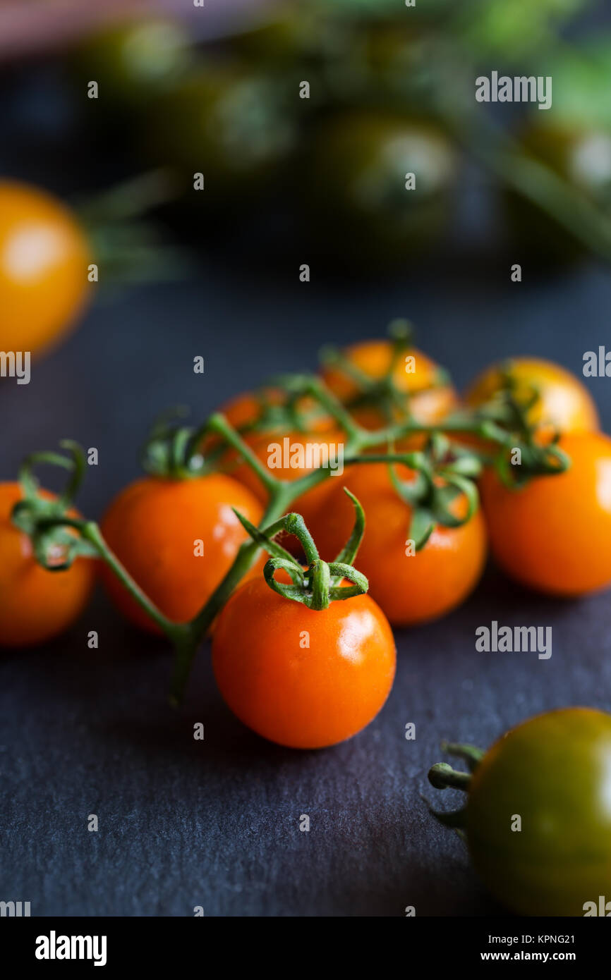 Arancione di pomodori ciliegini Foto Stock