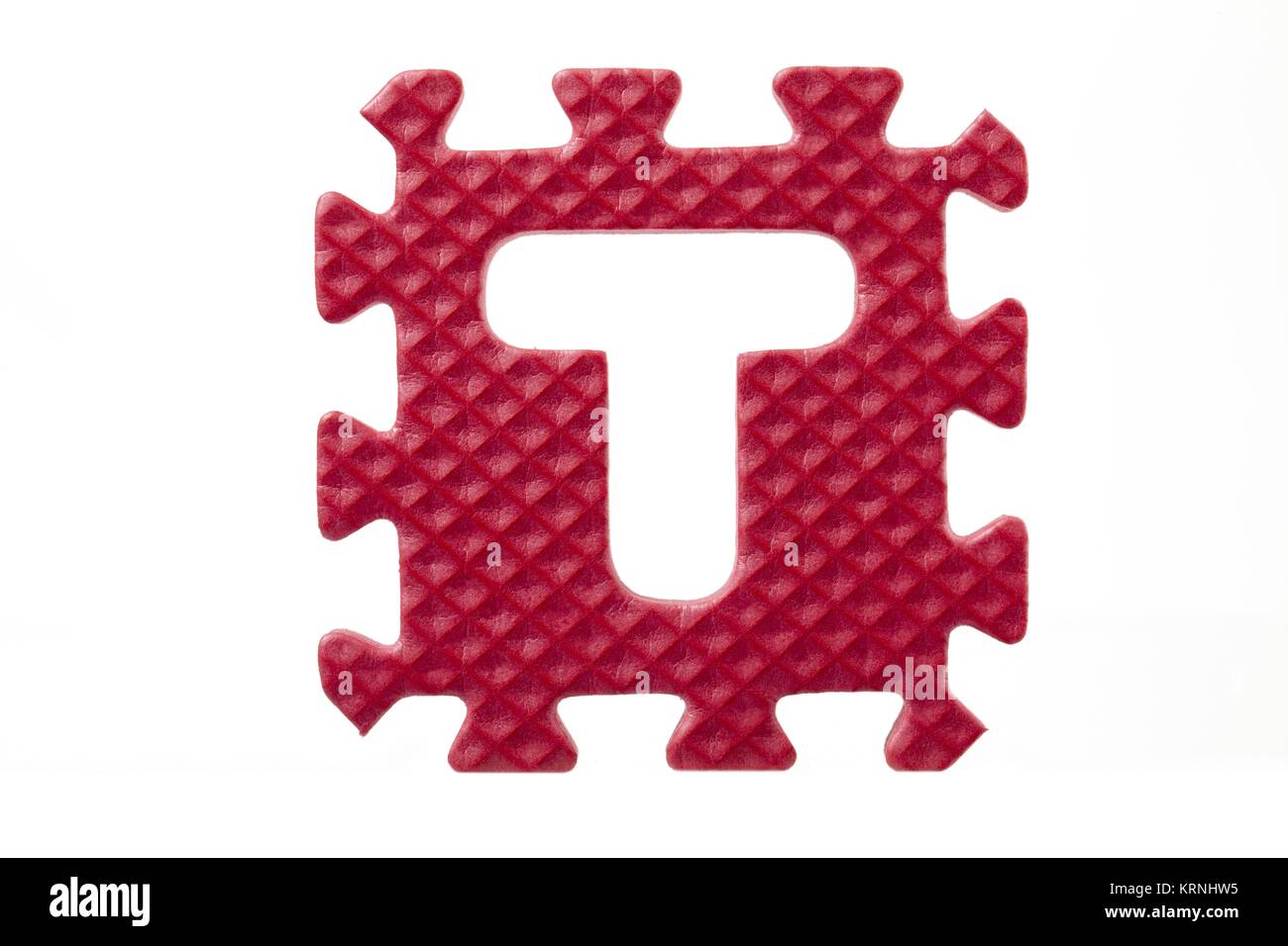 Rosso puzzle di gomma con la lettera t Foto Stock