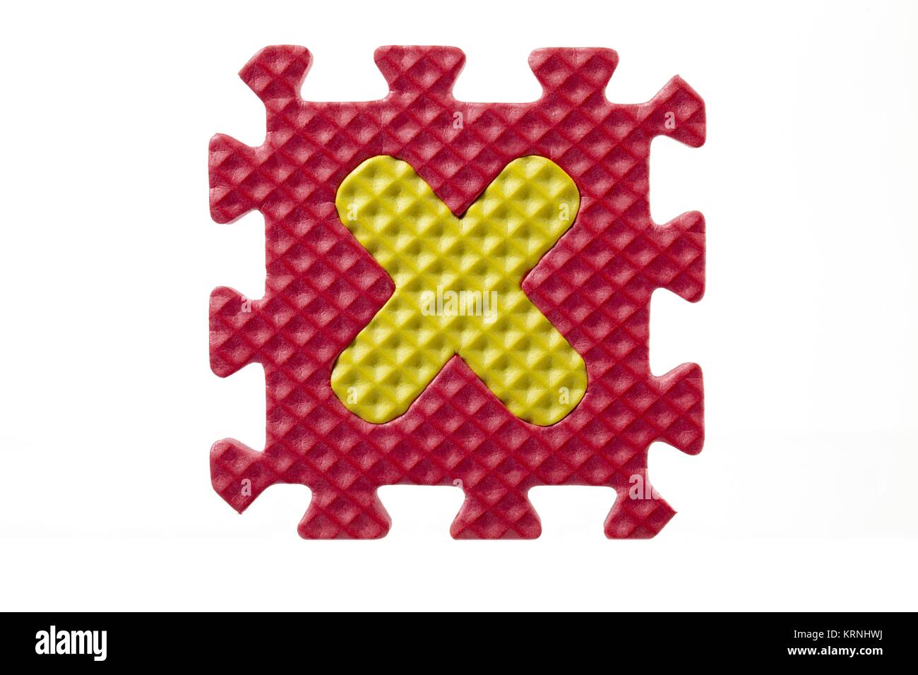 Alfabeto in gomma puzzle su una lettera x Foto Stock