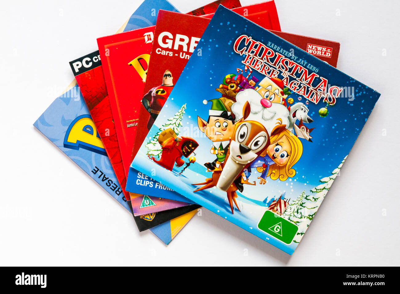 Selezione dei bambini del DVD con il Natale è di nuovo qui sulla parte superiore impostato su sfondo bianco Foto Stock