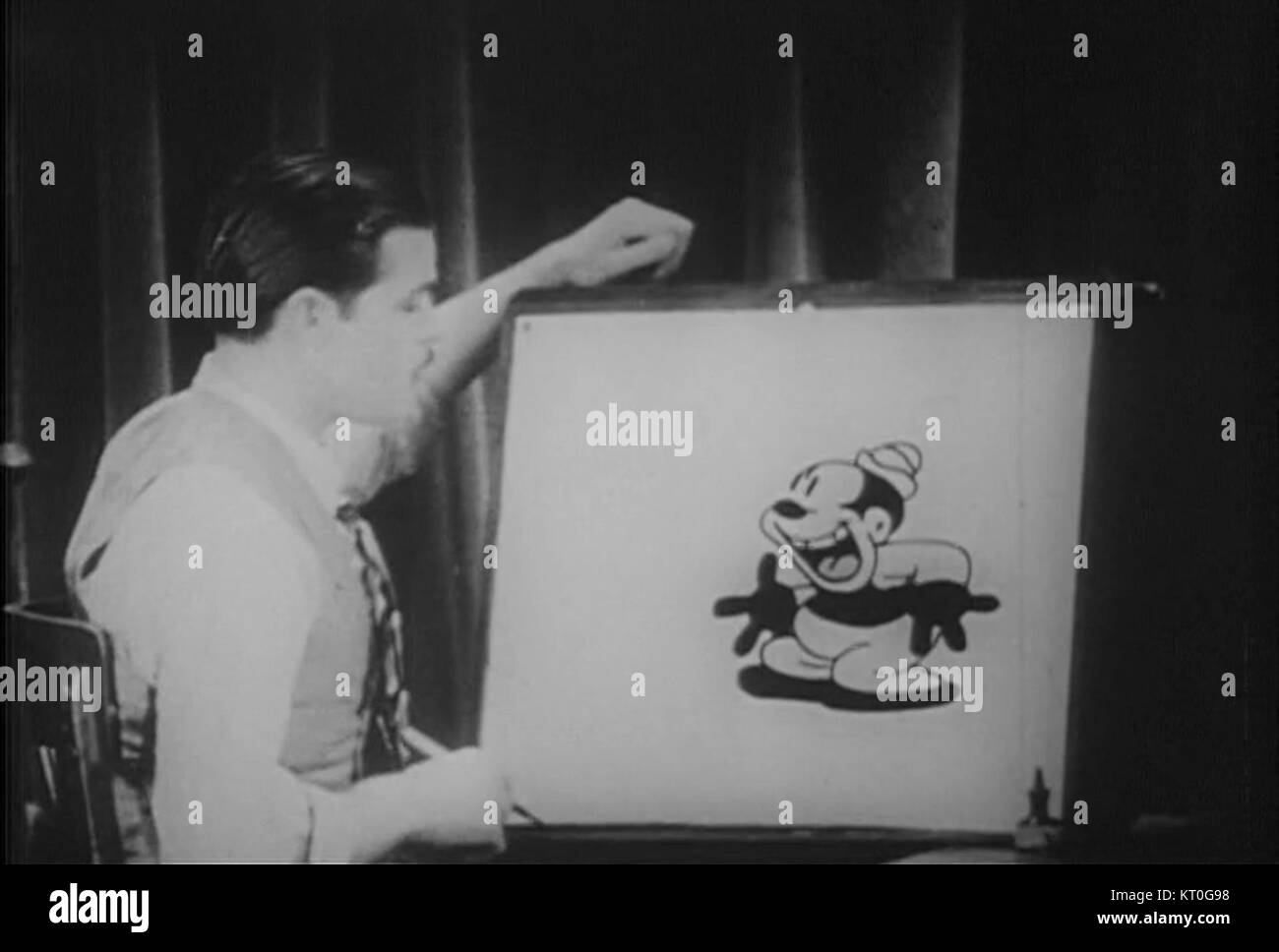 Bosko the Talk Ink Kid è un classico personaggio animato dell'animazione dei primi anni del XX secolo. È apparso in una serie di cartoni animati prodotti dalla Warner Bros. Negli anni '1930 Bosko era noto per la sua personalità energica e le buffonate comiche, rappresentando una figura significativa nella storia dell'animazione. Foto Stock