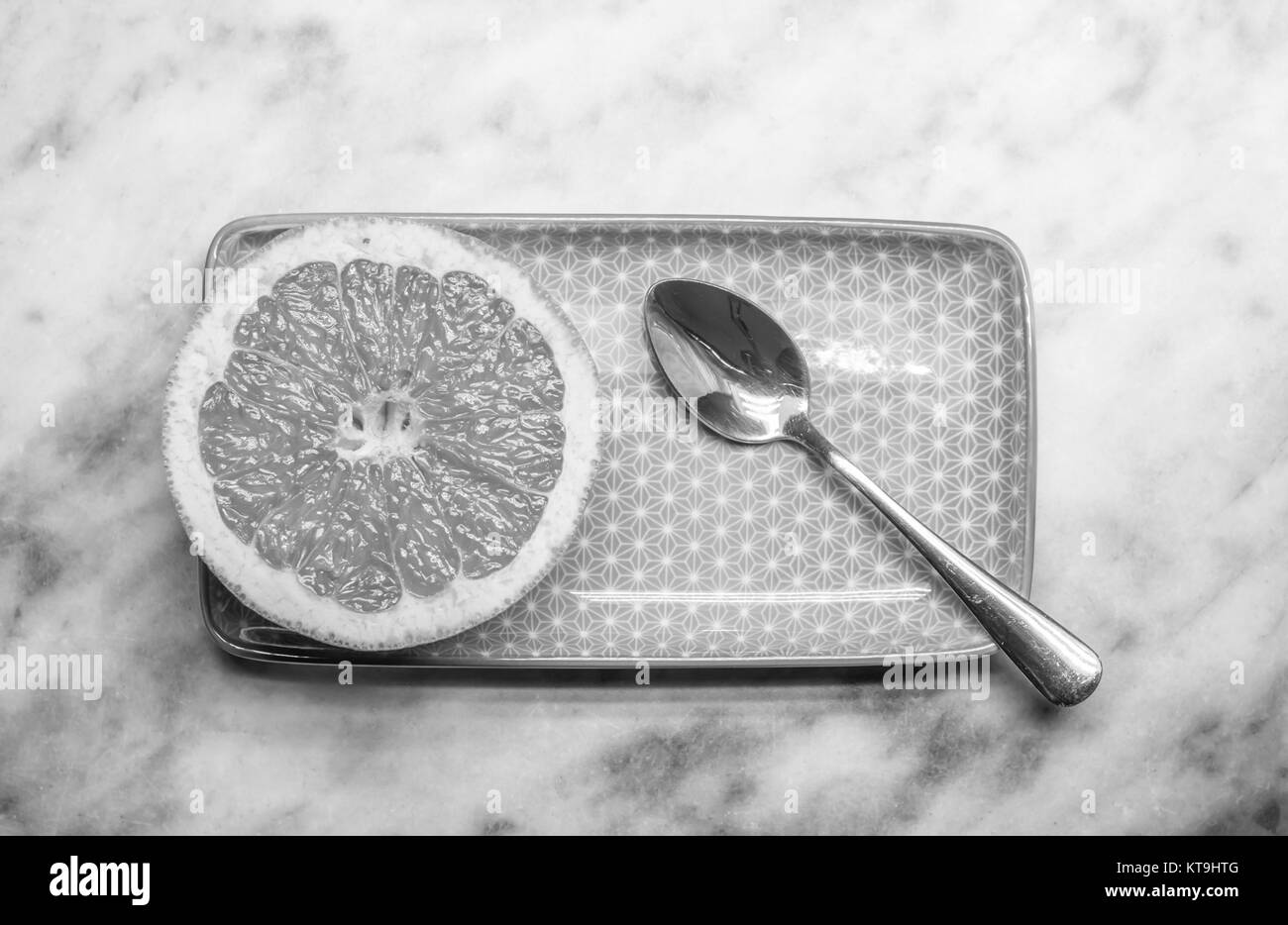 Bianco nero di pompelmo piastra rettangolare e cucchiaio Foto Stock