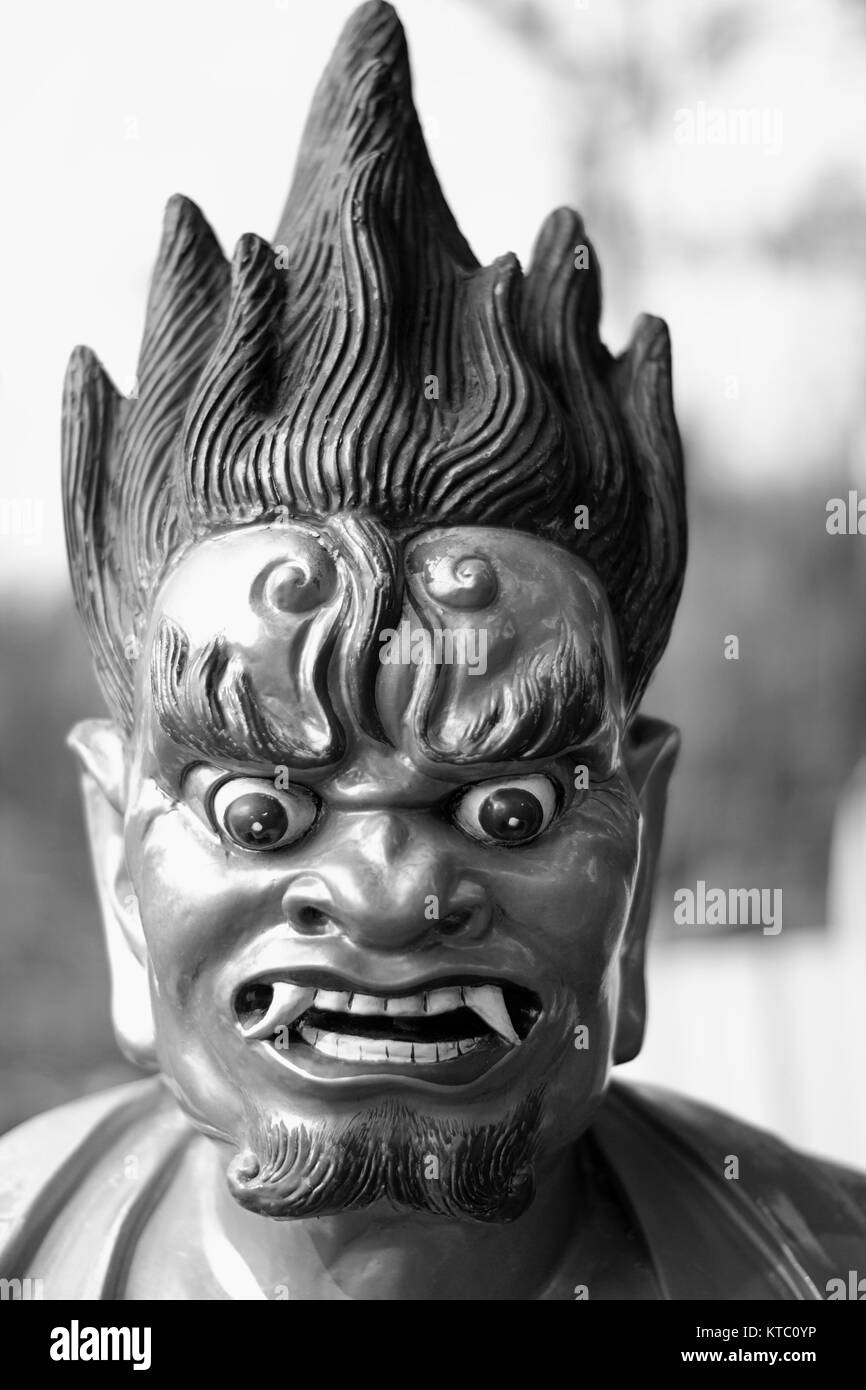 Culturale Cinese scultura d'oro rosso occhi e capelli bianco nero Foto Stock
