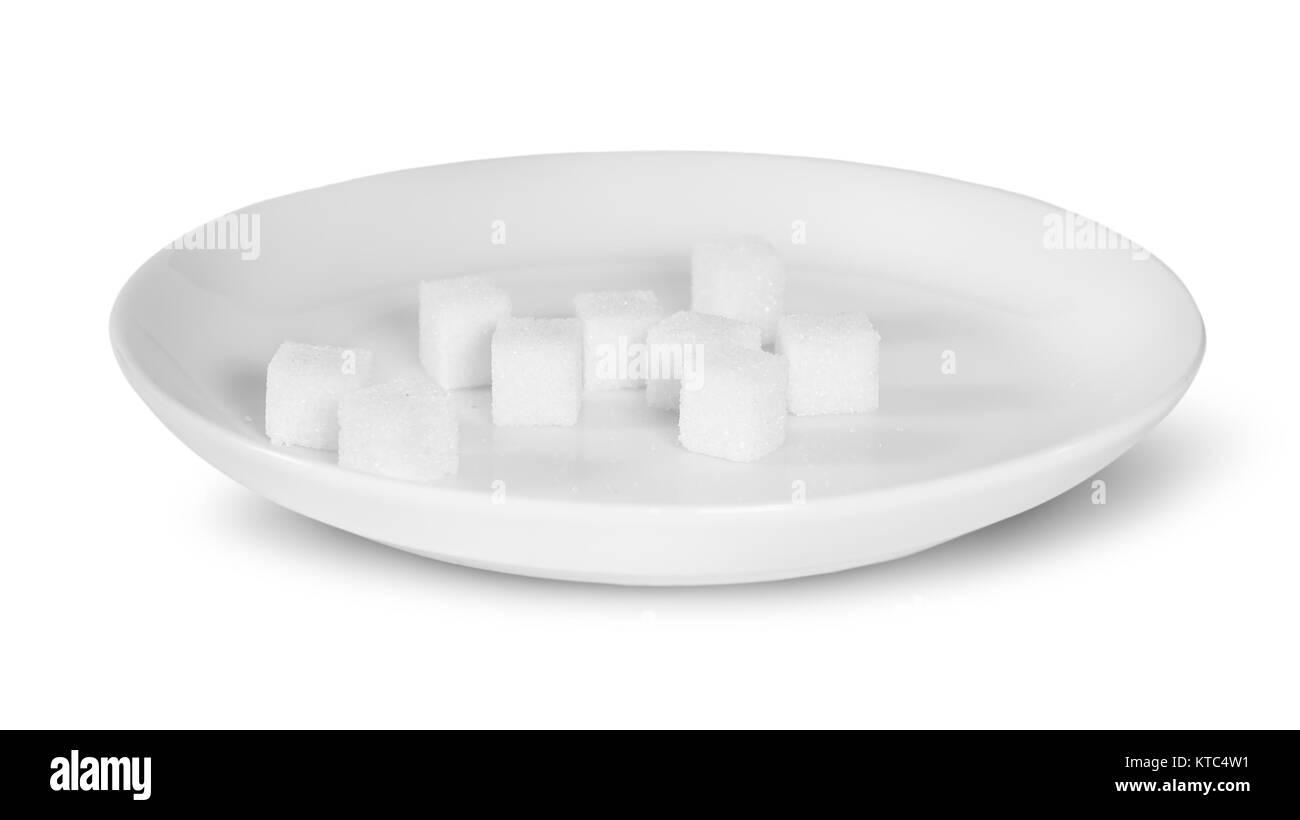 Zollette di zucchero su una piastra bianca Foto Stock