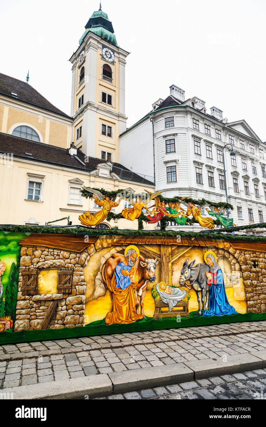 Strada colorato presepe murale presso la tradizionale stagione festiva Altwiener Christkindlmarkt, vecchia Vienna Christmas Market, Freyung, Vienna Foto Stock