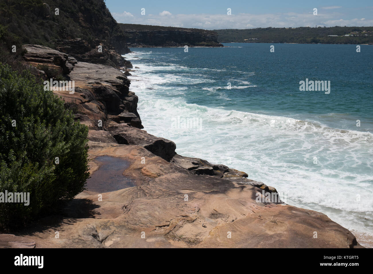 Sydney natura acqua onda acqua blu cielo scogliera di roccia Foto Stock