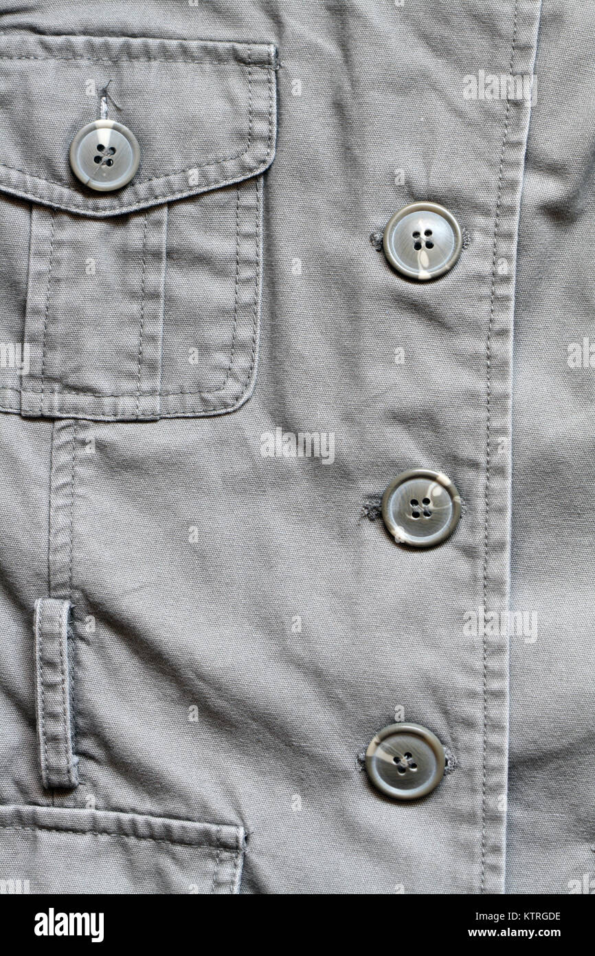 Extreme closeup di kaki giacca con pulsanti e pocket Foto Stock