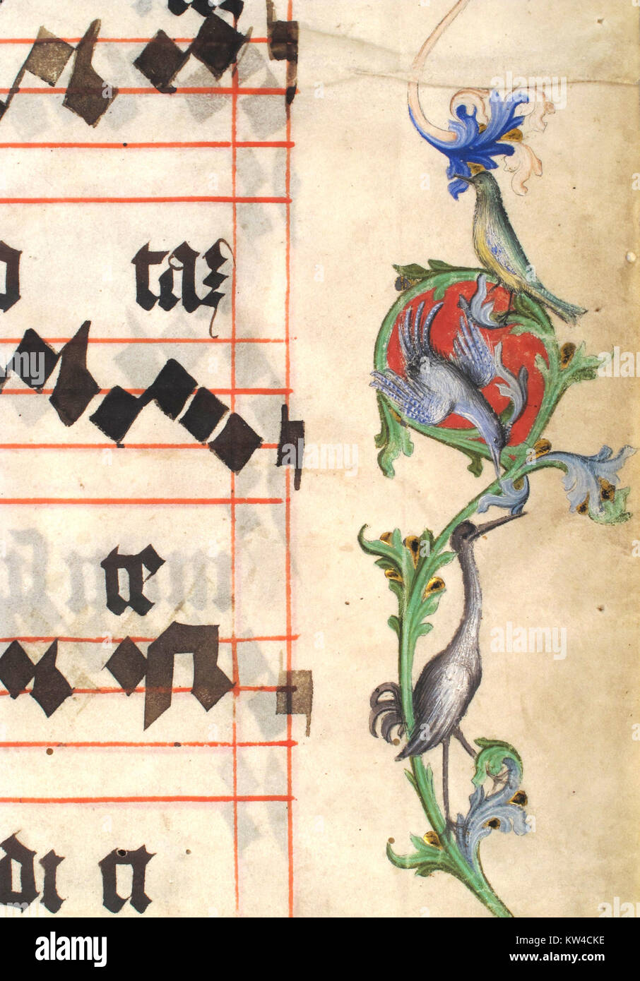 Questo bifolium presenta un manoscritto miniato che raffigura Cristo in Maestà all'interno di un'iniziale "A". Fa parte di un antifonario, un libro utilizzato per il canto liturgico, che mette in evidenza l'arte e la scrittura religiosa medievale. Foto Stock