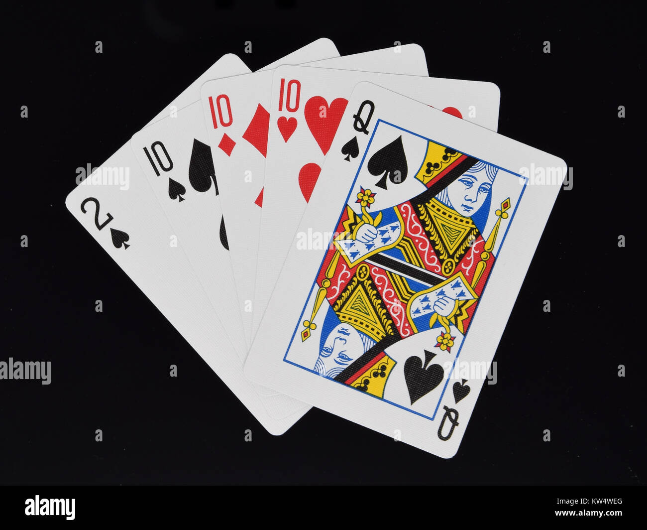 Tre di un genere in mano poker gioco di carte Foto Stock