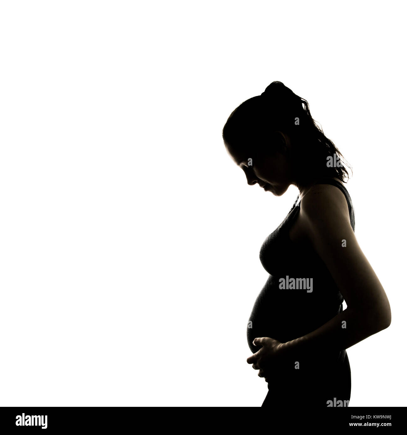 Gravidanza baby bump silhouette di una giovane donna in piedi. punto di vista laterale, trimestre, maternità Foto Stock