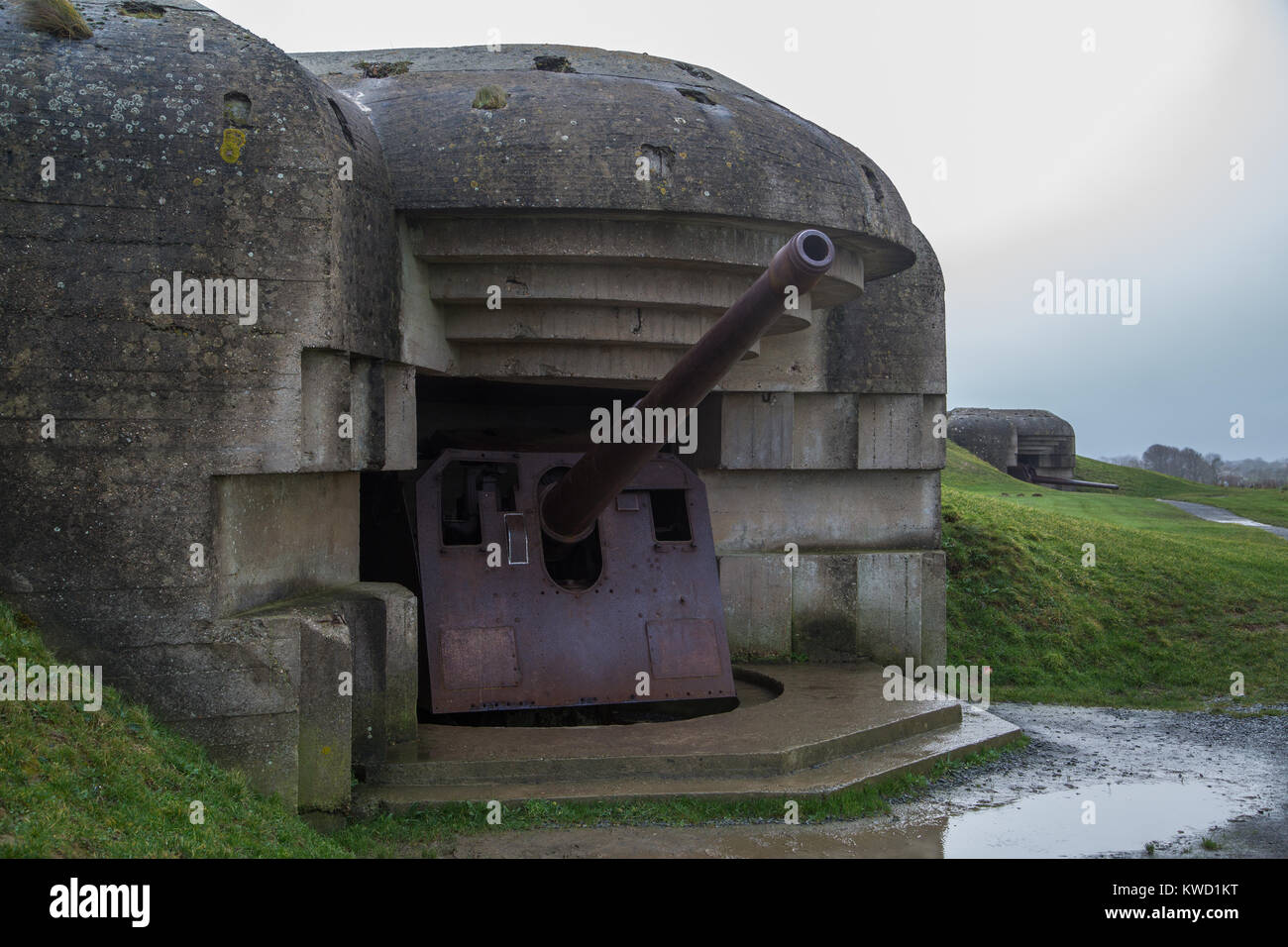 Batteria n. 3 a Longues sur Mer Calvados con i resti della sua 15cm pistola. Foto Stock