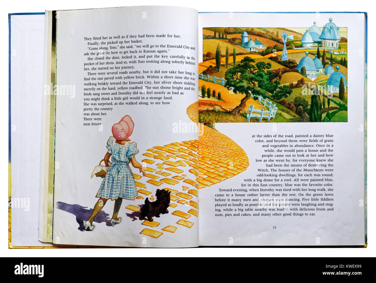 Dorothy sul mattone giallo strada in un libro illustrato del Wizard of Oz Foto Stock