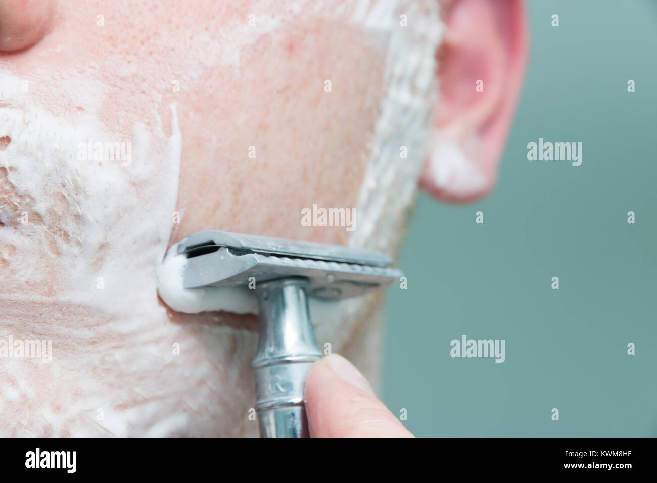 Chiudere la rasatura una faccia Foto Stock