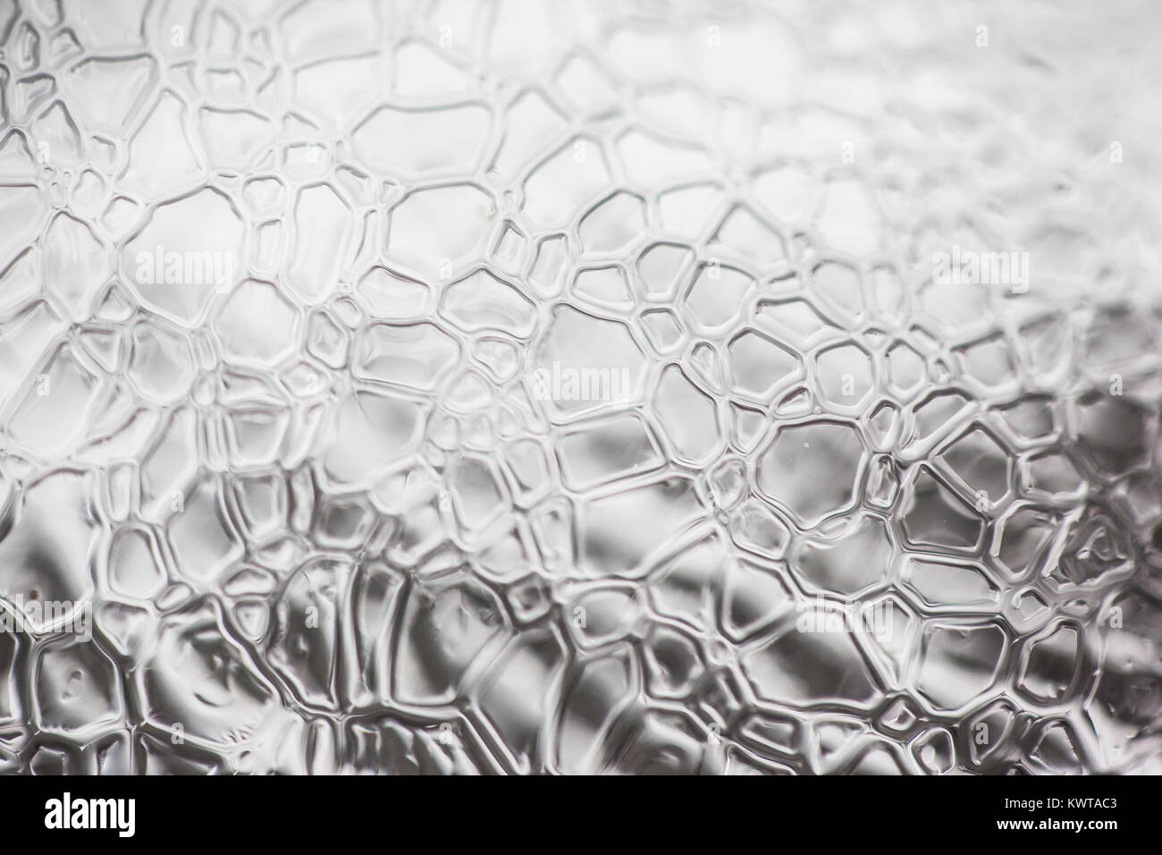 Abstract intricate chiudere i pattern su un pezzo di ghiaccio. Foto Stock