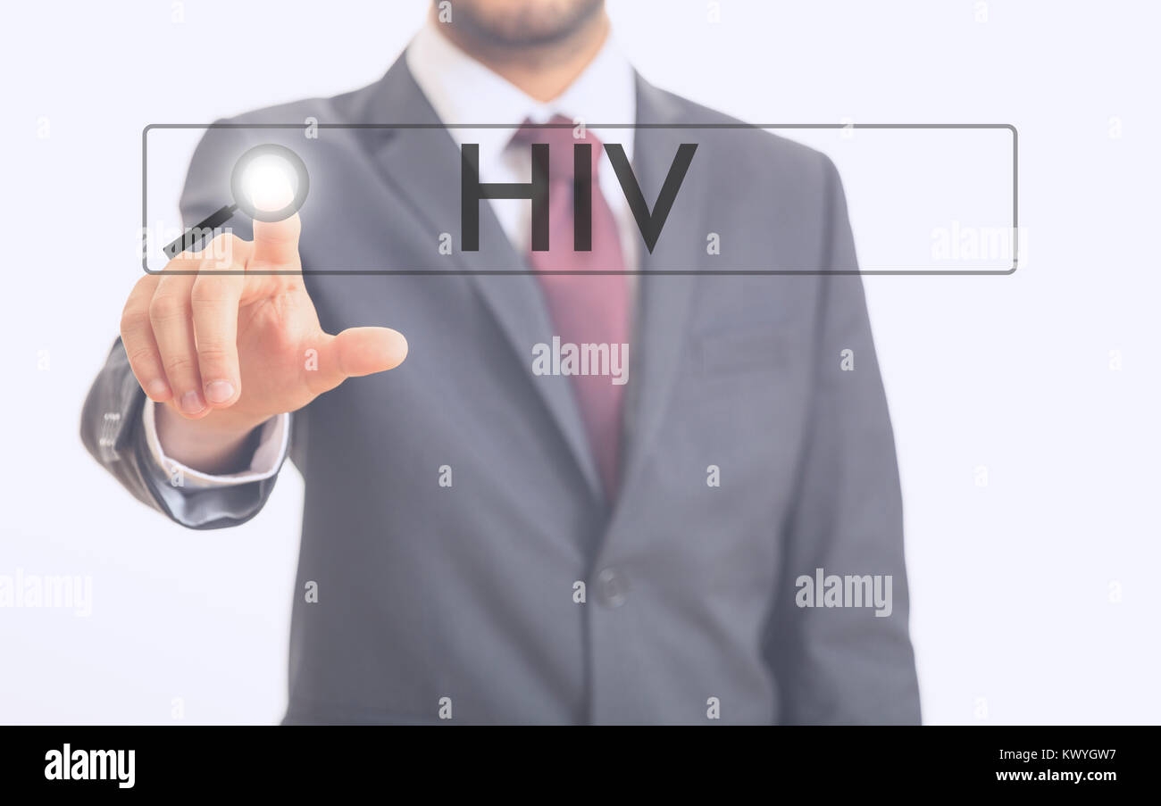 L'uomo puntando alla parola HIV su sfondo bianco Foto Stock