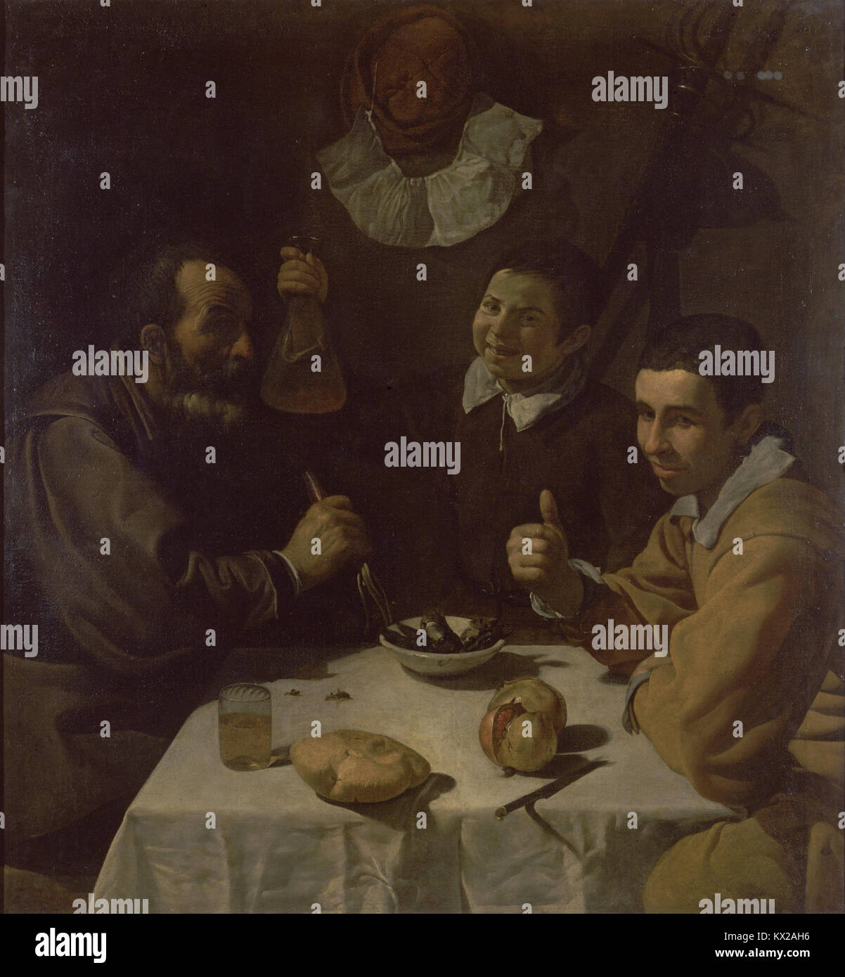Questo dipinto di Diego Velázquez, intitolato *Breakfast*, raffigura un momento di svago con notevole attenzione ai dettagli e alla composizione. La maestria di Velázquez nella luce e nella consistenza è evidente, tipica del suo lavoro nel periodo barocco spagnolo. Foto Stock