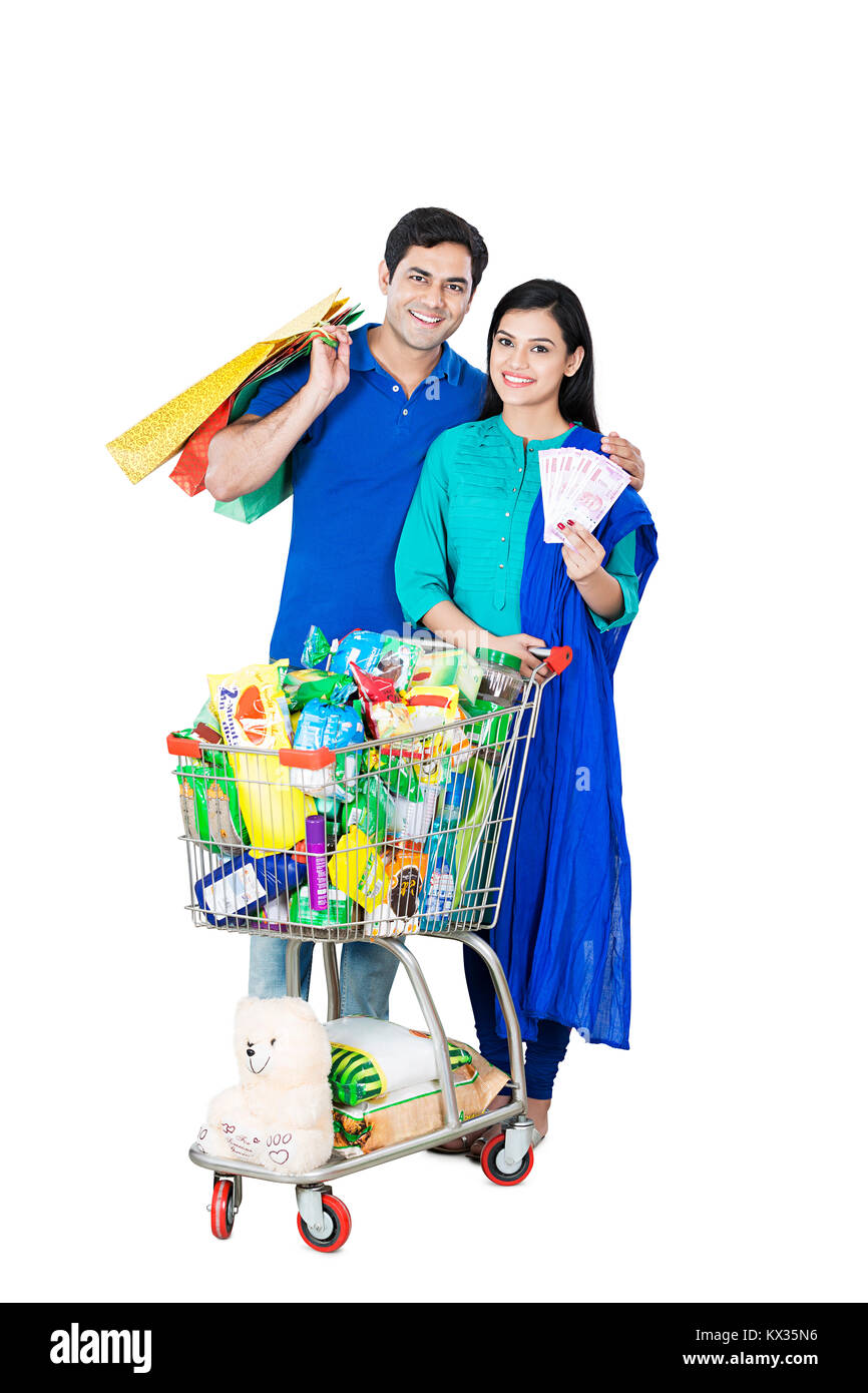 2 Married-Couple carrello, tenendo Shopping Bag con denaro contante Foto Stock