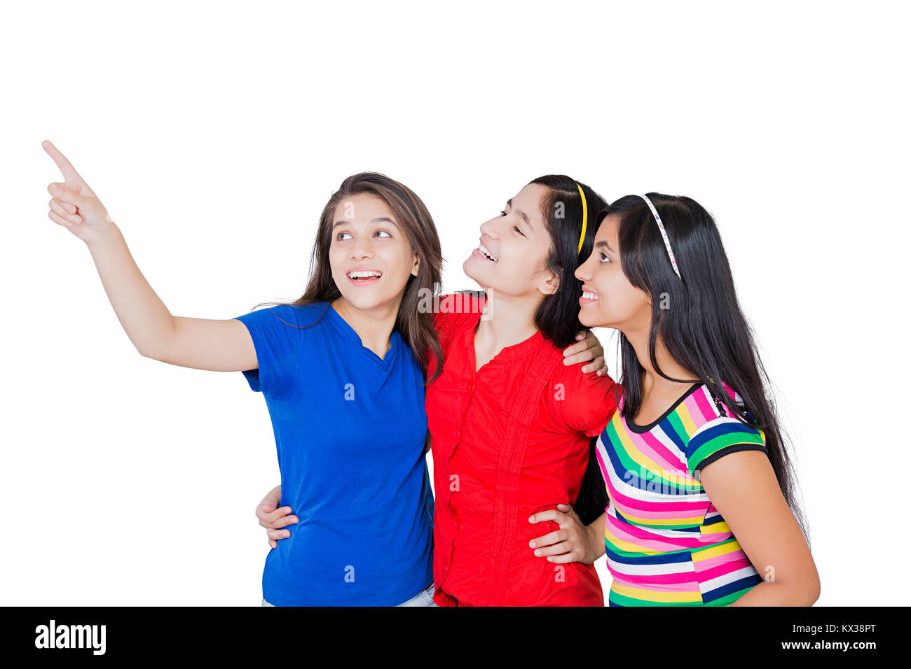 3 Indian giovani adolescenti ragazze amici puntare il dito che mostra il divertimento Foto Stock