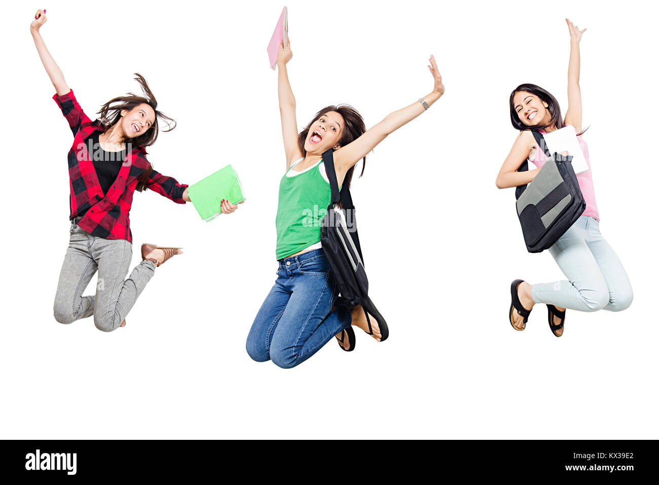 3 Indian College ragazze studenti Jumping Grida allegre Selebrating di successo Foto Stock