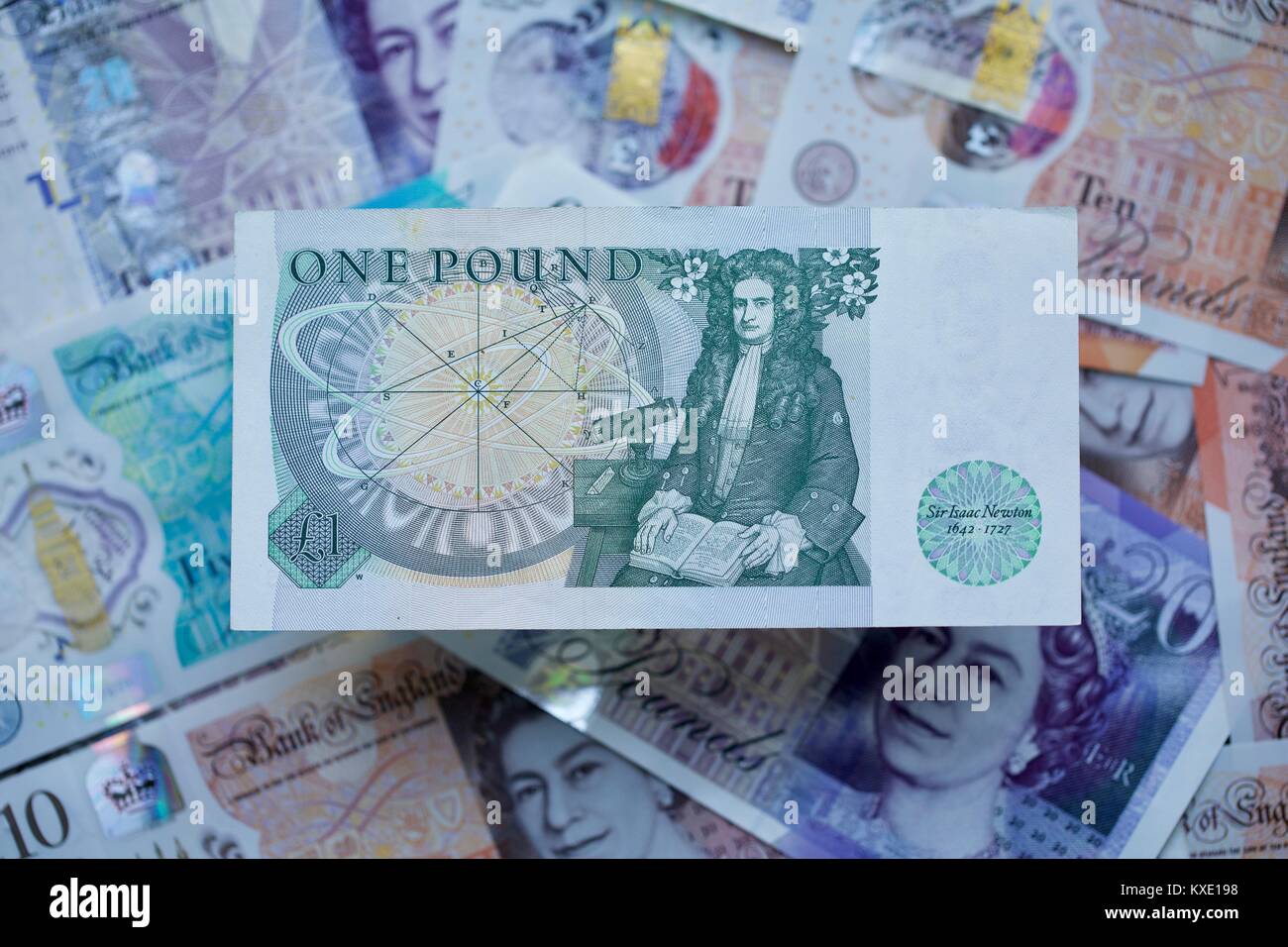 British £1 pound banconota con il nuovo polimero banconote in background Foto Stock