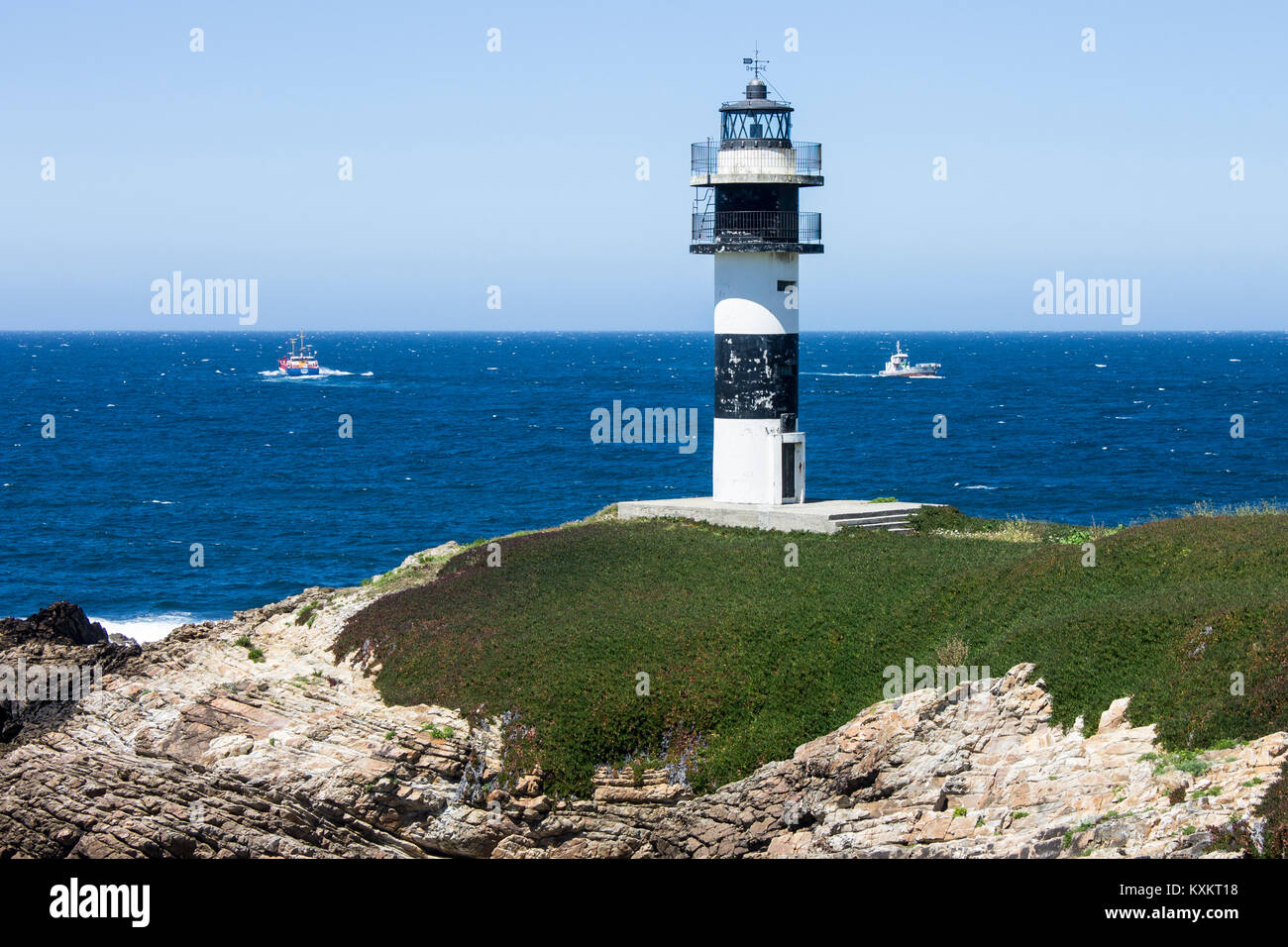 Illa Pancha in Spagna, una bellissima isola con due fari a guardia della Eo estuario che delimita il confine tra la Galizia e Asturie. Foto Stock