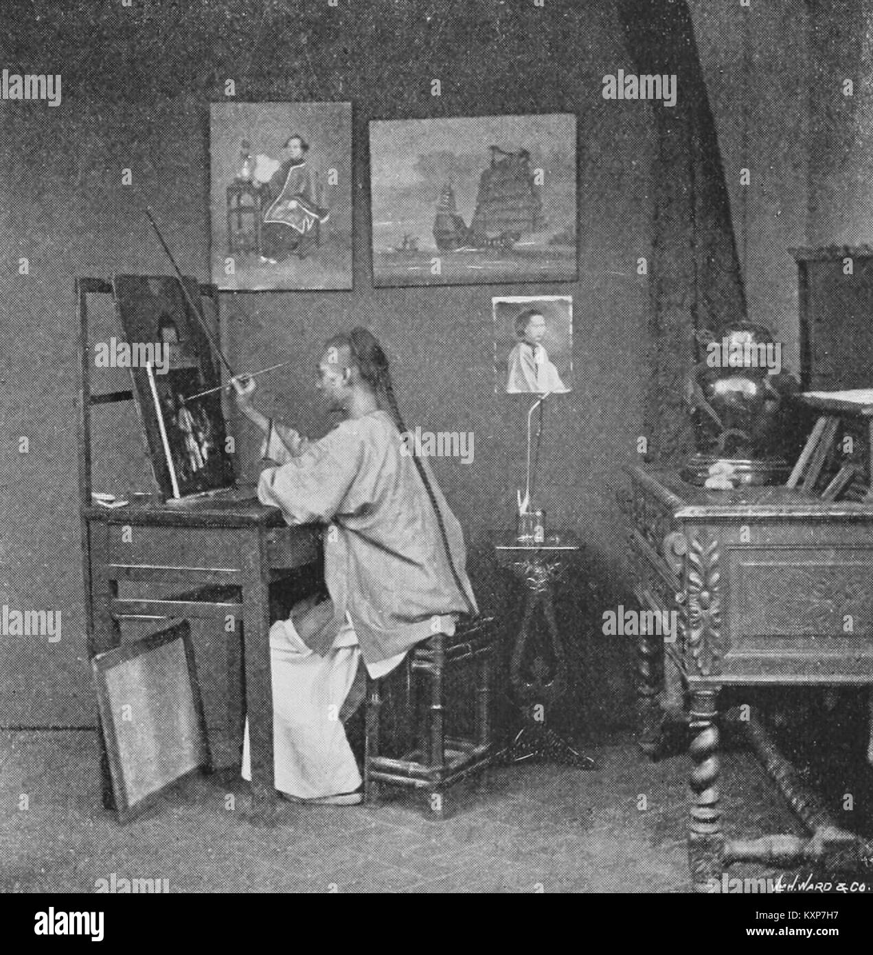 Un artista cinese impegnato in pratiche artistiche tradizionali o contemporanee, che riflettono il patrimonio culturale e artistico cinese. Foto Stock