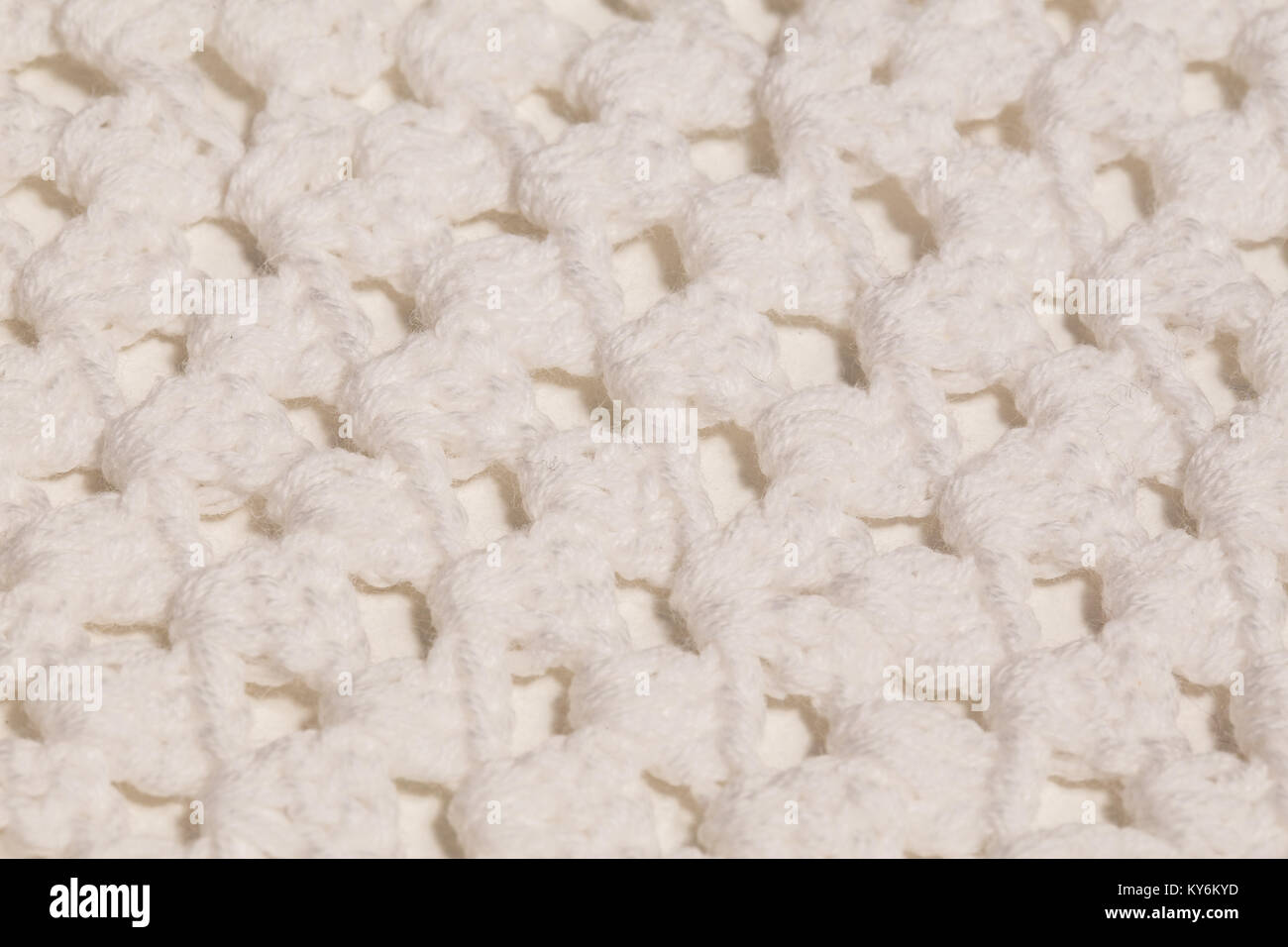 Macro immagine di colore bianco di tessitura a maglia. Foto Stock