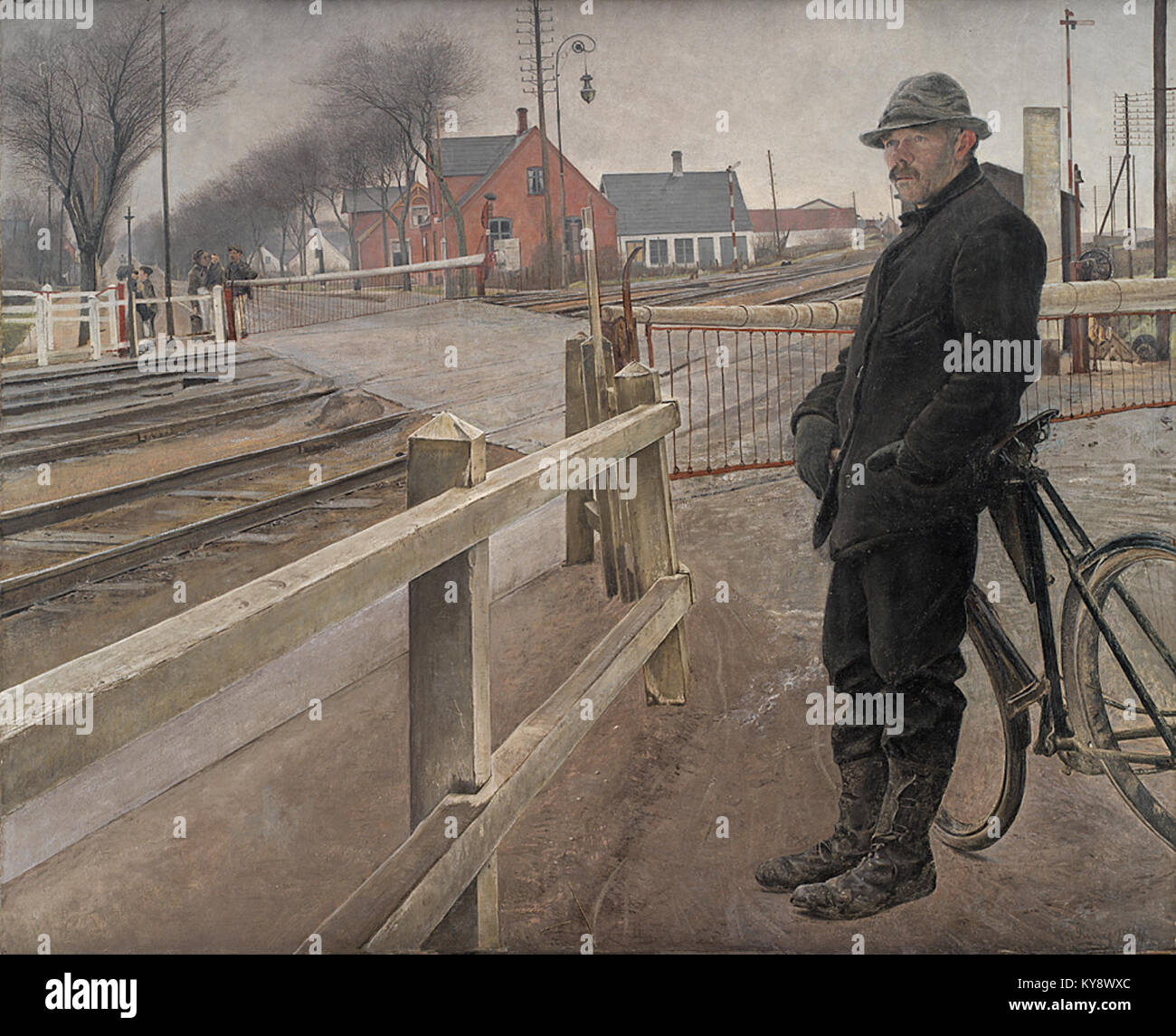Una rappresentazione di un passaggio ferroviario a Roskilde Landevej, che cattura i treni in attesa e le infrastrutture di trasporto in Danimarca. Foto Stock