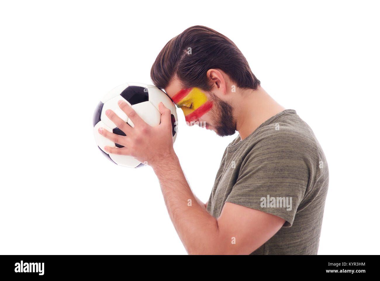 Tifoso di calcio pregando per la vittoria Foto Stock