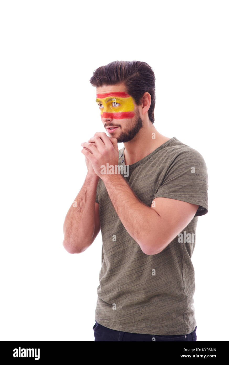 Vista laterale della ventola nervoso con la bandiera della Spagna sulla faccia pregare Foto Stock