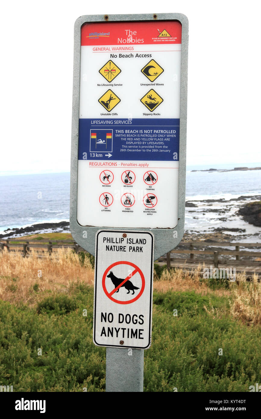 Segnale di avvertimento tavole a Seal Rock e i Nobbies Phillip Island Foto Stock