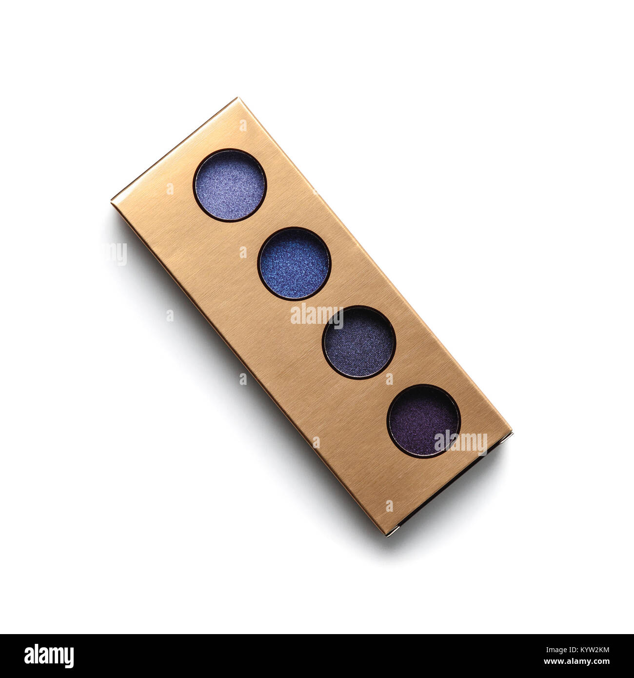 Vista superiore del contenitore dorato con differenti ombreggiato occhi viola le ombre su bianco Foto Stock