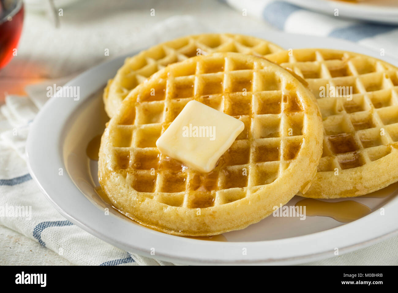 Marrone caldo cialde Freezer con burro e sciroppo d'acero Foto Stock