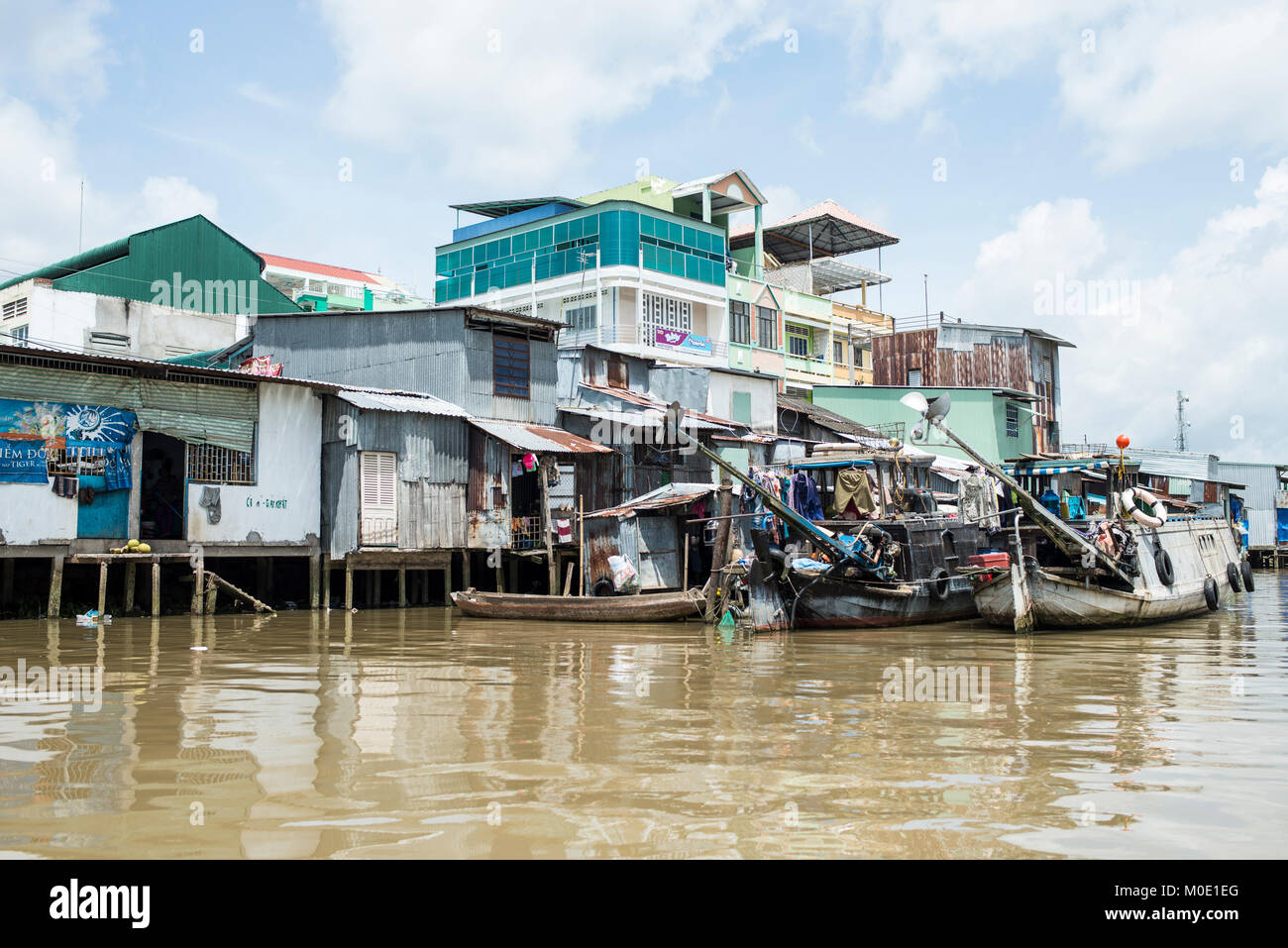 Barche da lavoro,il fiume Mekong, Vietnam Foto Stock