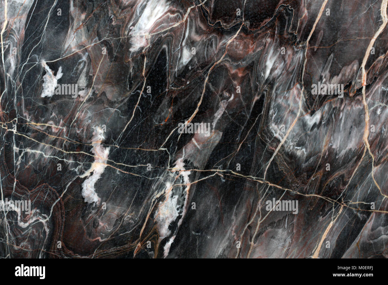 Mulicolored naturale scuro marmo. Sullo sfondo di una pietra naturale. Foto Stock