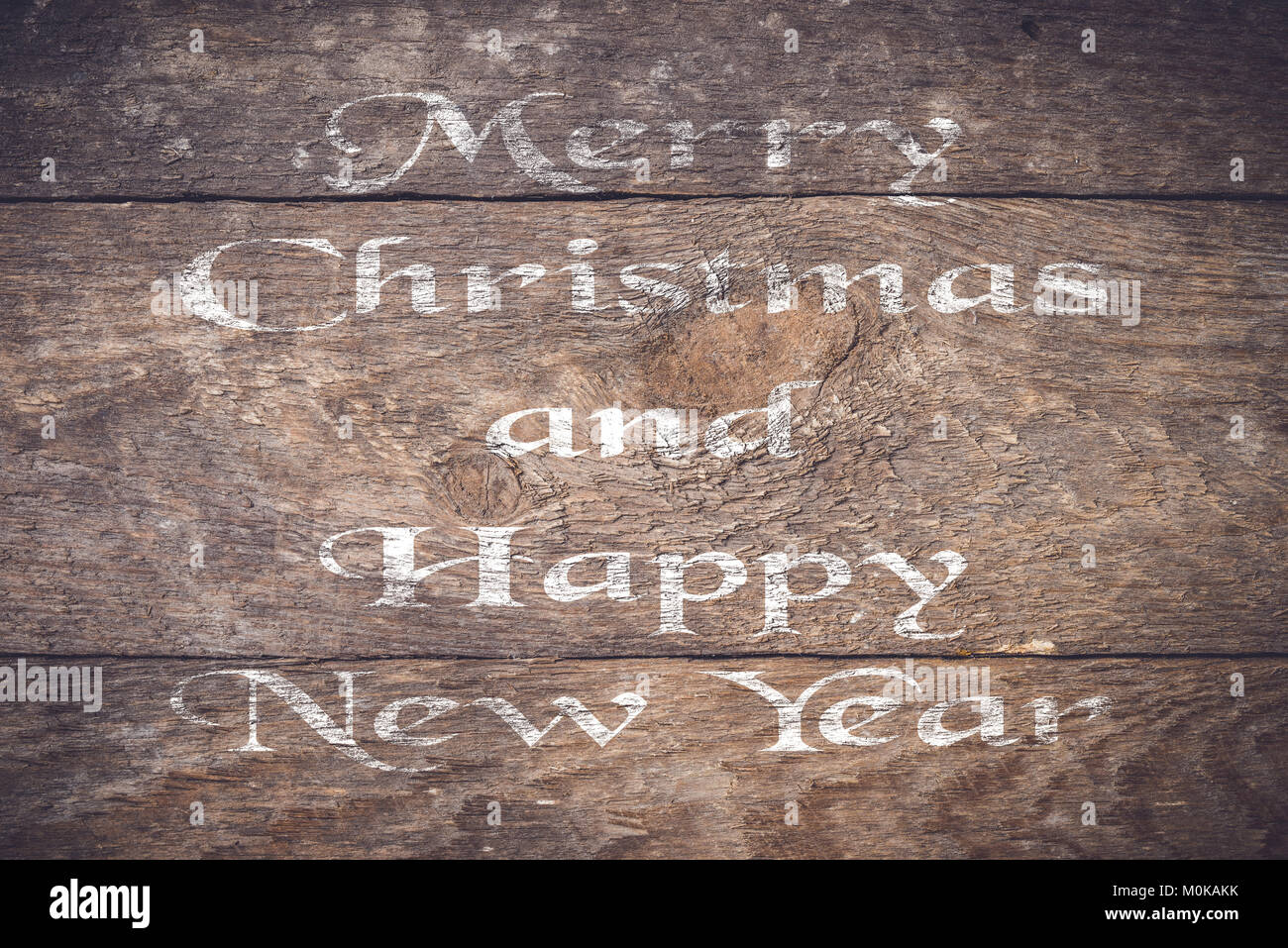 Auguri di Natale su un vecchio ceppo di legno Foto Stock