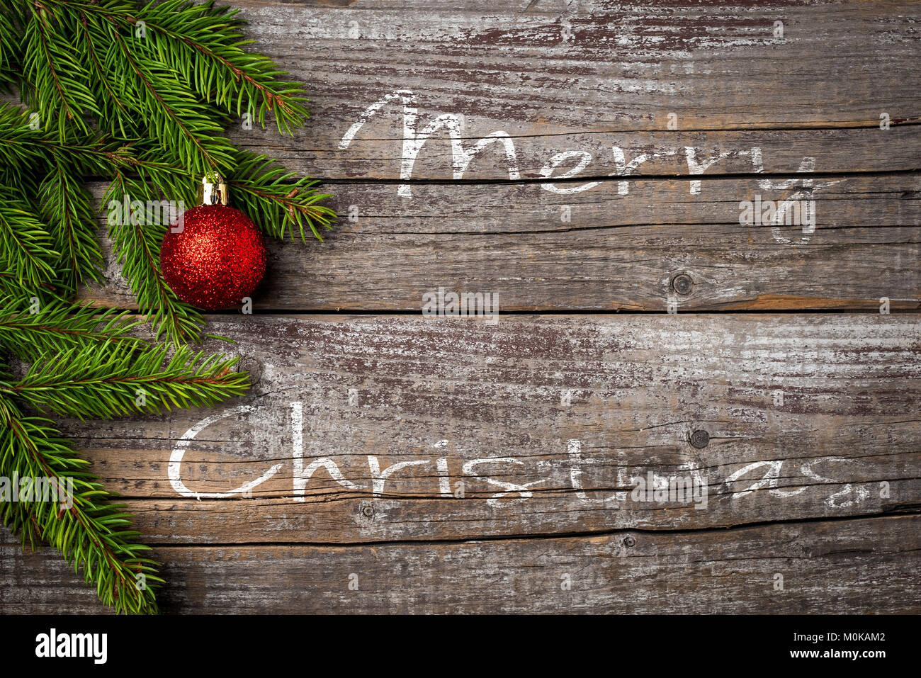 Auguri di Natale su un vecchio ceppo di legno Foto Stock