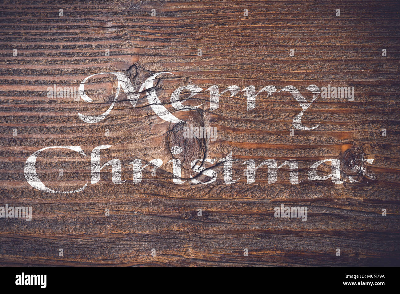 Auguri di Natale su un vecchio ceppo di legno Foto Stock