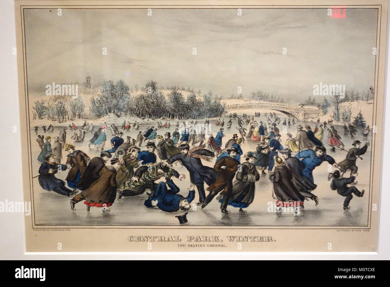Questa litografia colorata a mano di Currier & Ives, intitolata "Central Park Winter, The Skating Carnival", cattura una scena invernale di pattinaggio su ghiaccio a Central Park. L'opera d'arte, non datata, fa parte della collezione Albany Institute of History and Art. Foto Stock