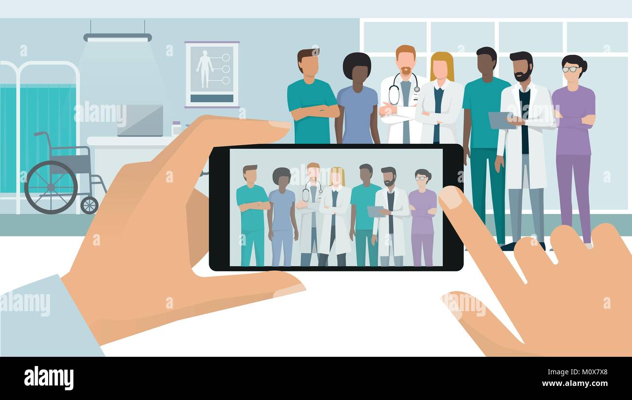 Professionale del personale medico e i medici che pongono insieme in ospedale, un uomo è di scattare una foto con uno smartphone, un punto di vista soggettivo Illustrazione Vettoriale