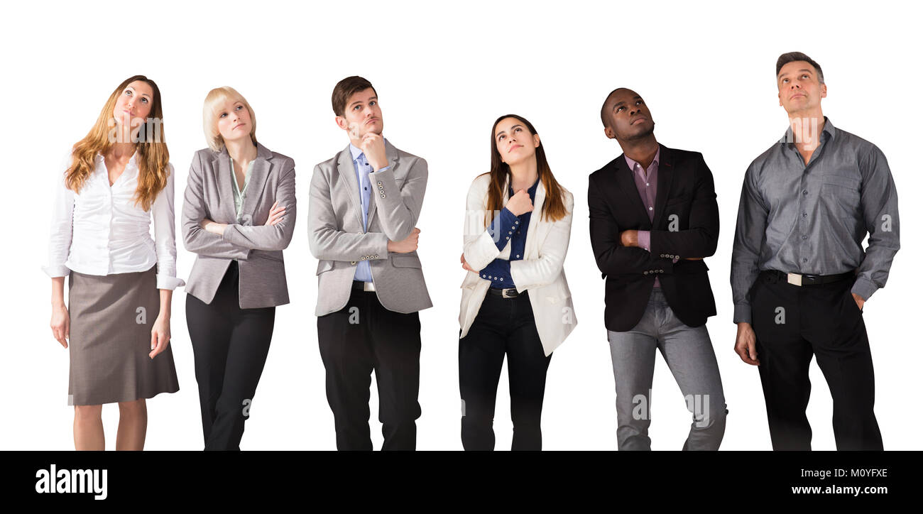 Gruppo di multi etnico la gente di affari giorno sognando contro uno sfondo bianco Foto Stock