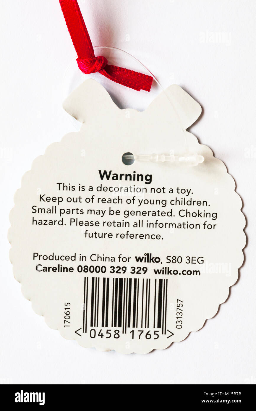 Etichetta di avvertimento sulla decorazione di Natale questa è una decorazione non è un giocattolo. Tenere fuori dalla portata dei bambini, le parti più piccole possono essere generati soffocamento. Foto Stock