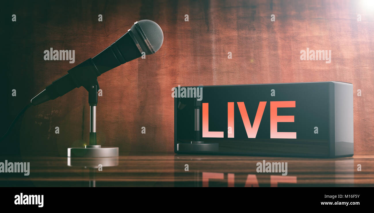 LIVE scritta su di una scatola nera e un microfono su una scrivania in legno. 3d illustrazione Foto Stock