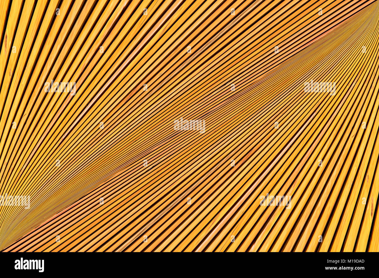 Abstract montaggio di foto giallo arancione di legname. Le linee convergenti di listelli. Foto Stock