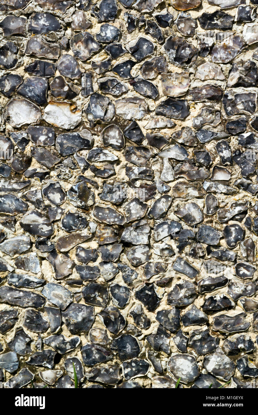 Vecchio tradizionale di pietra focaia parete di materiale di riempimento o infill close up full frame Foto Stock