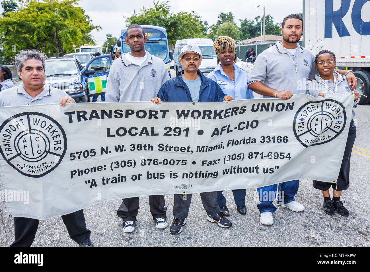 Miami Florida,Liberty City,Martin Luther King Jr. Parade,partecipante,comunità Black banner,Transport Workers Union,uomo uomini maschio,donna donne,FL Foto Stock