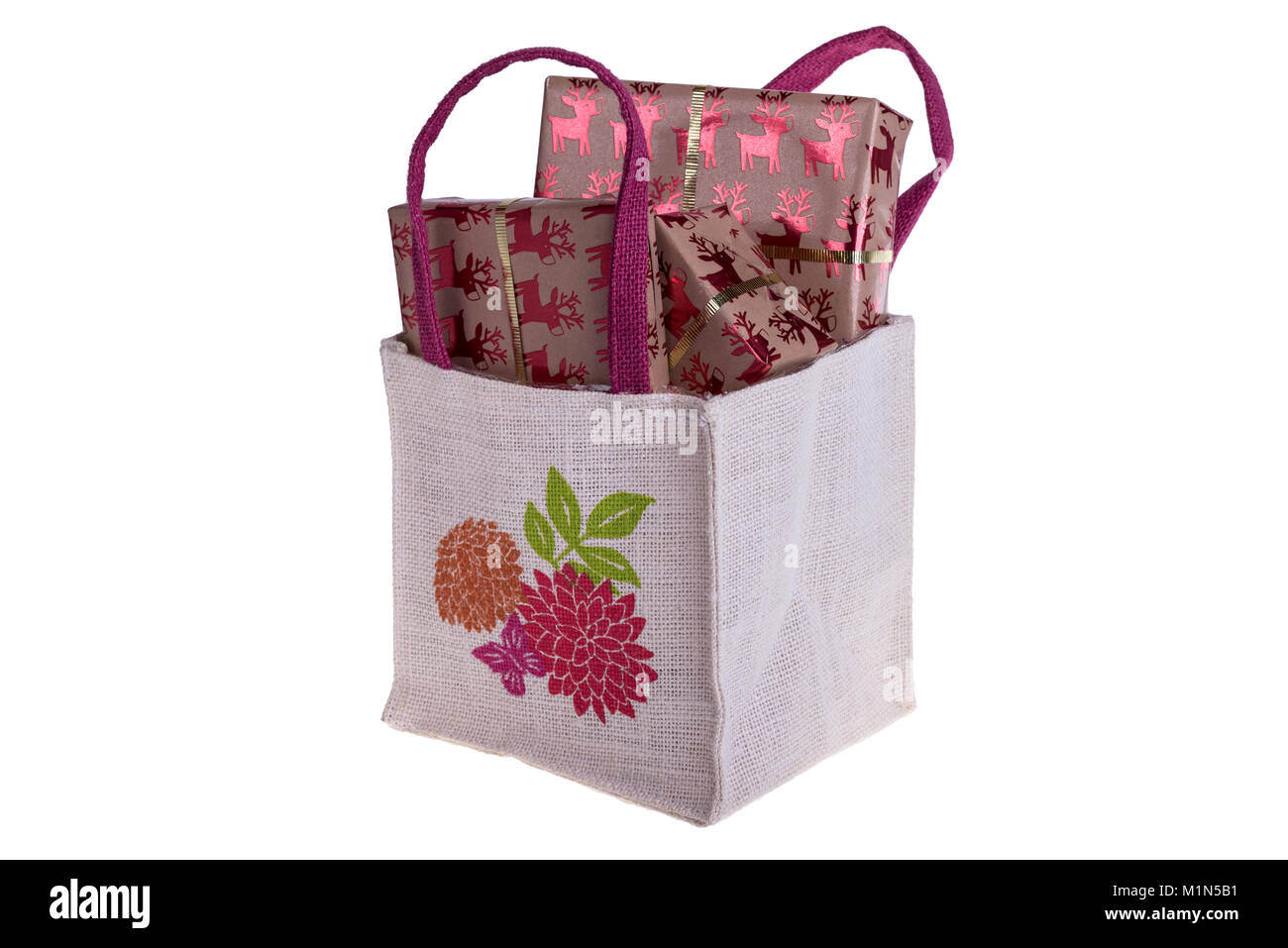 Hessian borsa riempita con regali impacchettati. Foto Stock